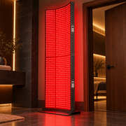 iLuxred X7000 black full-body red light therapy panel in a luxury wellness suite